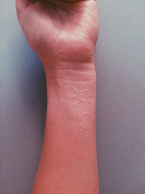 White Ink Sun Moon Tattoo Idea