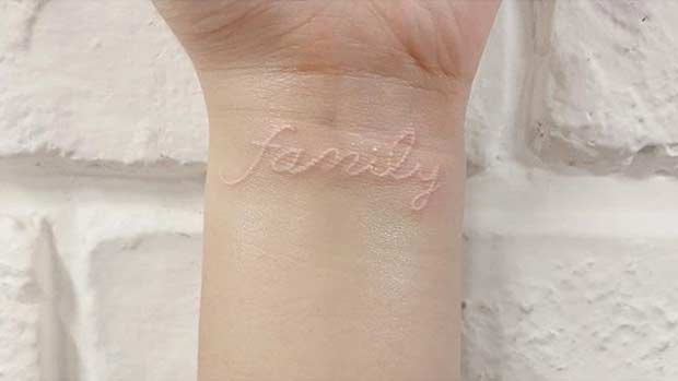 White Ink Family Wrist Tattoo