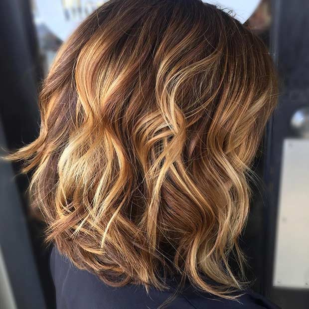 Curly Long Bob Hairstyle with Golden Highlights