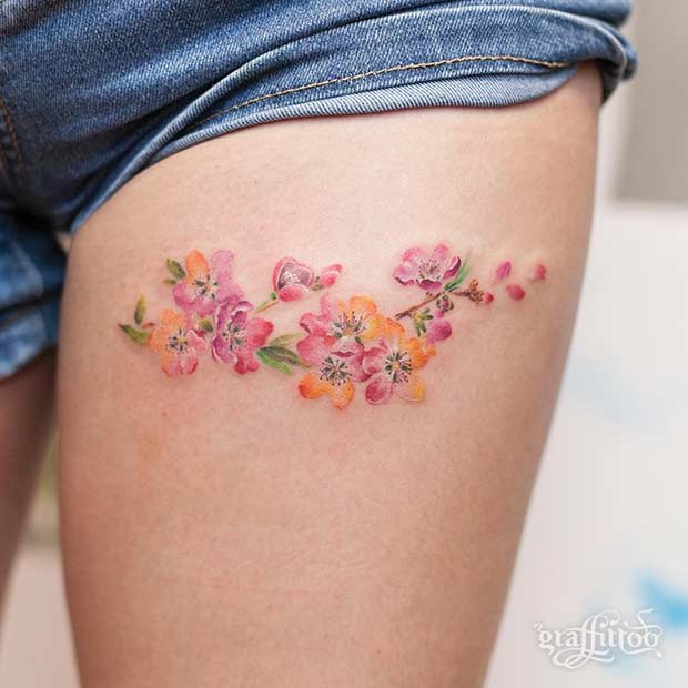 Small Thigh Flower Watercolor Tattoo Idea for Women