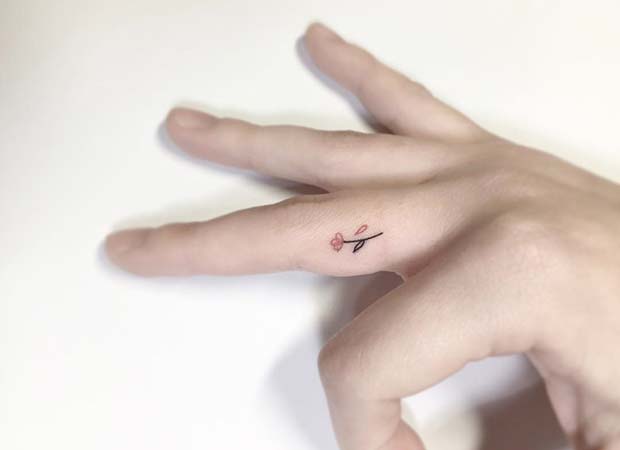 Tiny Flower Finger Tattoo Idea