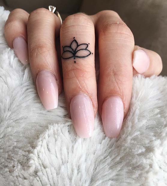 lotus flower finger tattoo