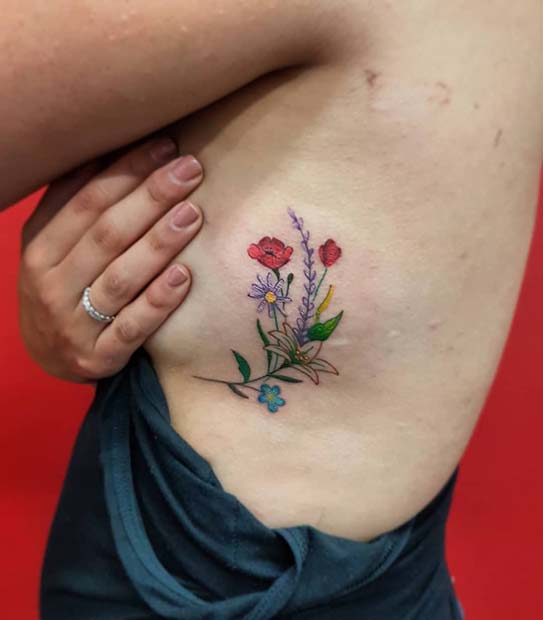 Colorful Floral Rib Tattoo Idea
