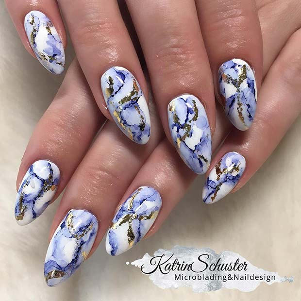 Elegant Blue and Gold Marble Nails