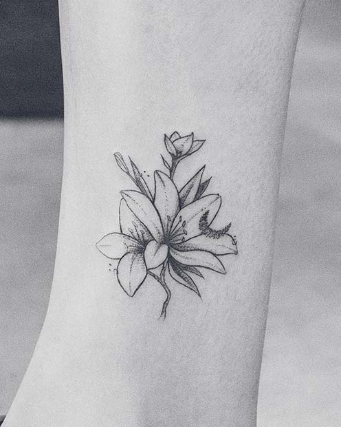 Lilies and Small Moon Tattoo Idea
