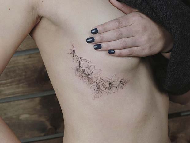Under Boob Tattoo with Flower Design