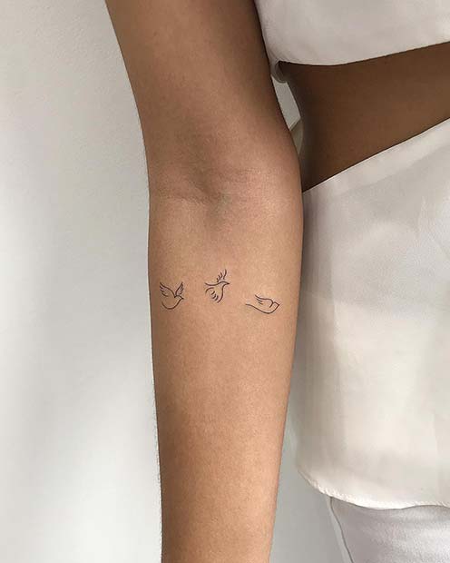 Tiny Dove Tattoo Idea for Women