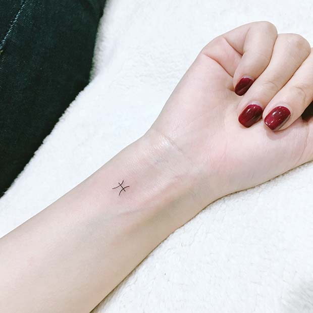 Tiny and Simple Star Sign Tattoo