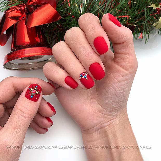 black nails with red gems