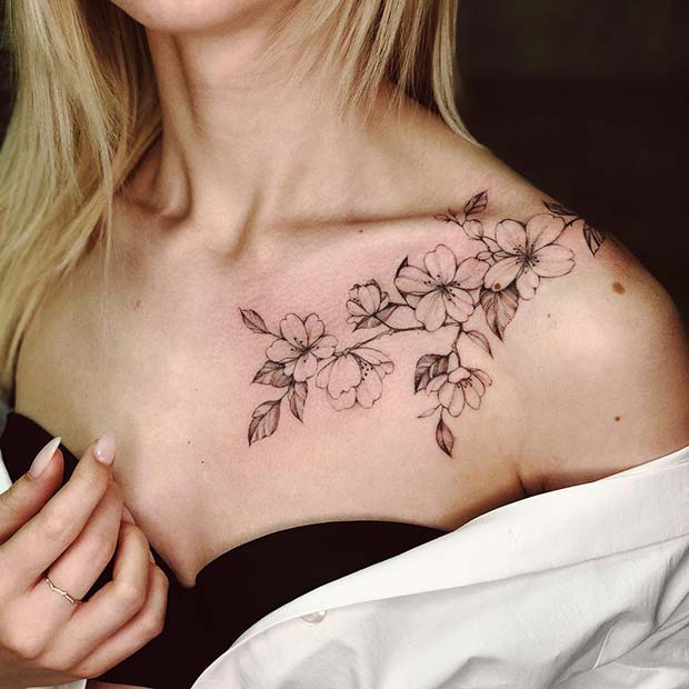 Dry flower tattoo on the left side collarbone