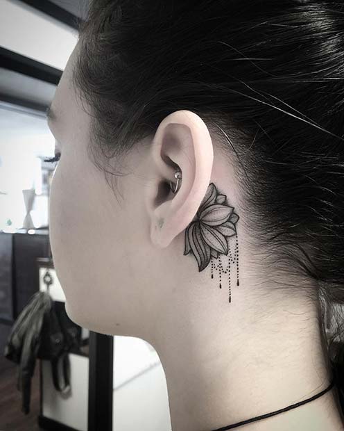 Rose tattoo behind the ear