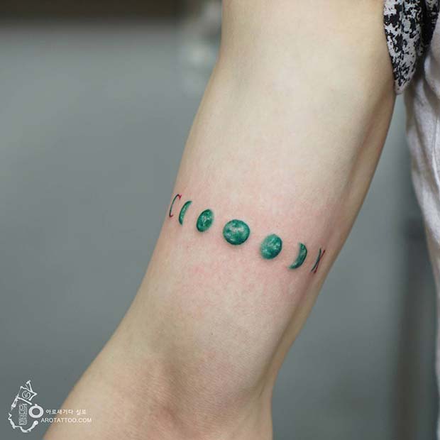 Minimalist moon phases behind the right arm
