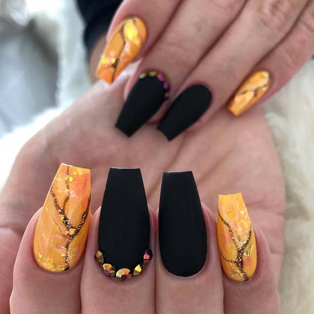Black Nails with a Marble Accent Design