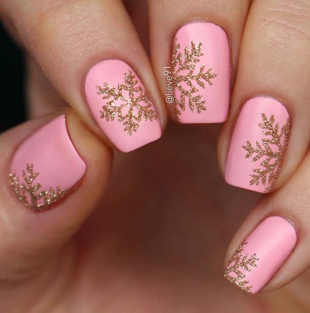 Light Pink Nails with Sparkly Gold Snowflakes