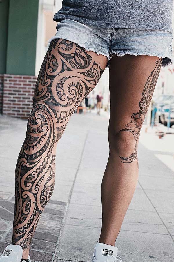 Full Leg Tattoo with Tribal Patterns