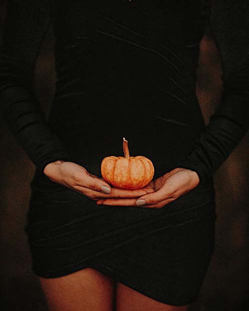 Cute Pregnancy Announcement with a Small Pumpkin