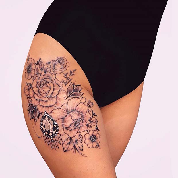 Floral Thigh Tattoo with a Bold Gem