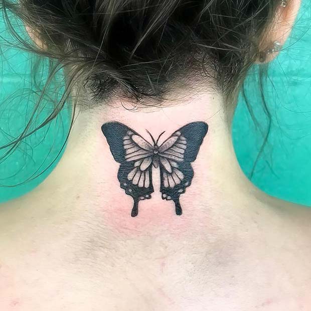 Black butterfly tattoo on back of neck